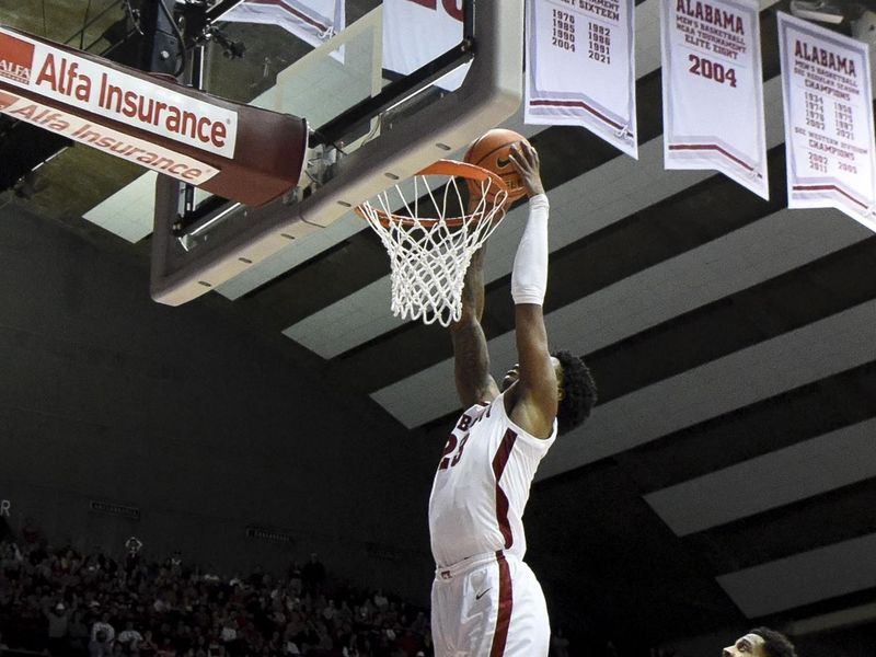 Feb 18, 2023; Tuscaloosa, Alabama, USA; Alabama Crimson Tide forward Nick Pringle (23) dunks against the Georgia Bulldogs at Coleman Coliseum. Alabama won 108-59. Mandatory Credit: Gary Cosby Jr.-USA TODAY Sports