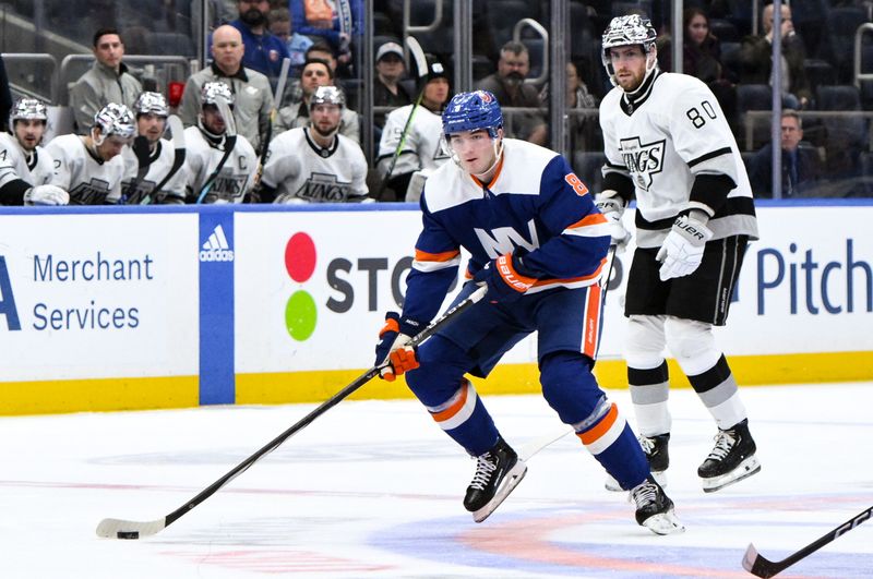 Dec 9, 2023; Elmont, New York, USA; New York Islanders defenseman Noah Dobson (8) skates with the puck past Los Angeles Kings center Pierre-Luc Dubois (80) during the second period at UBS Arena. Mandatory Credit: John Jones-USA TODAY Sports