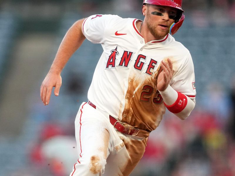 Apr 30, 2024; Anaheim, California, USA; Los Angeles Angels second baseman Brandon Drury (23) runs to third base in the second inning against the Philadelphia Phillies at Angel Stadium. Mandatory Credit: Kirby Lee-USA TODAY Sports