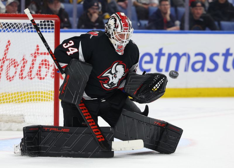 Feb 5, 2026; Buffalo, New York, USA;  Buffalo Sabres goaltender Alex Lyon (34) looks to make a save during the third period against the Pittsburgh Penguins at KeyBank Center. Mandatory Credit: Timothy T. Ludwig-Imagn Images