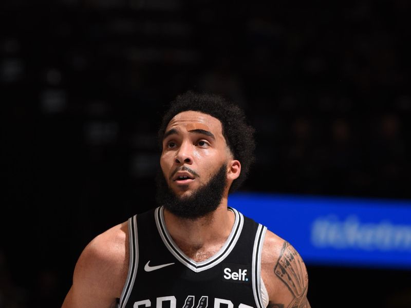 MEMPHIS, TN - APRIL 9: Julian Champagnie #30 of the San Antonio Spurs shoots a free throw during the game against the Memphis Grizzlies  on April 9, 2024 at FedExForum in Memphis, Tennessee. NOTE TO USER: User expressly acknowledges and agrees that, by downloading and or using this photograph, User is consenting to the terms and conditions of the Getty Images License Agreement. Mandatory Copyright Notice: Copyright 2024 NBAE (Photo by Grant Burke/NBAE via Getty Images)