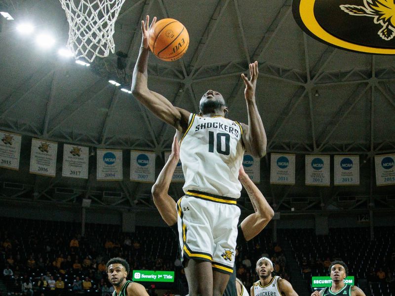 Jan 4, 2024; Wichita, Kansas, USA; Wichita State Shockers forward Dalen Ridgnal (10) goes up for a rebound during the second half against the North Texas Mean Green at Charles Koch Arena. Mandatory Credit: William Purnell-USA TODAY Sports