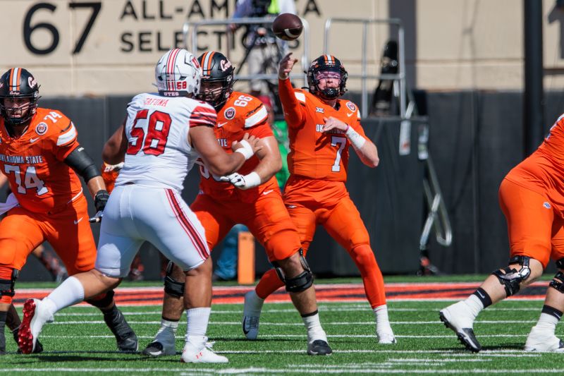 Sep 21, 2024; Stillwater, Oklahoma, USA; Oklahoma State Cowboys quarterback Alan Bowman (7) passes during the second quarter against the Utah Utes at Boone Pickens Stadium. Mandatory Credit: William Purnell-Imagn Images