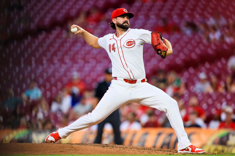 Aug 28, 2024; Cincinnati, Ohio, USA; Cincinnati Reds relief pitcher Casey Kelly (84) pitches against the Oakland Athletics in the sixth inning at Great American Ball Park. Mandatory Credit: Katie Stratman-USA TODAY Sports