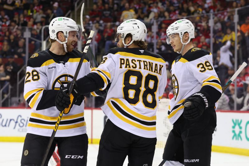 Apr 8, 2025; Newark, New Jersey, USA; Boston Bruins right wing David Pastrnak (88) celebrates his goal against the New Jersey Devils during the first period at Prudential Center. Mandatory Credit: Ed Mulholland-Imagn Images