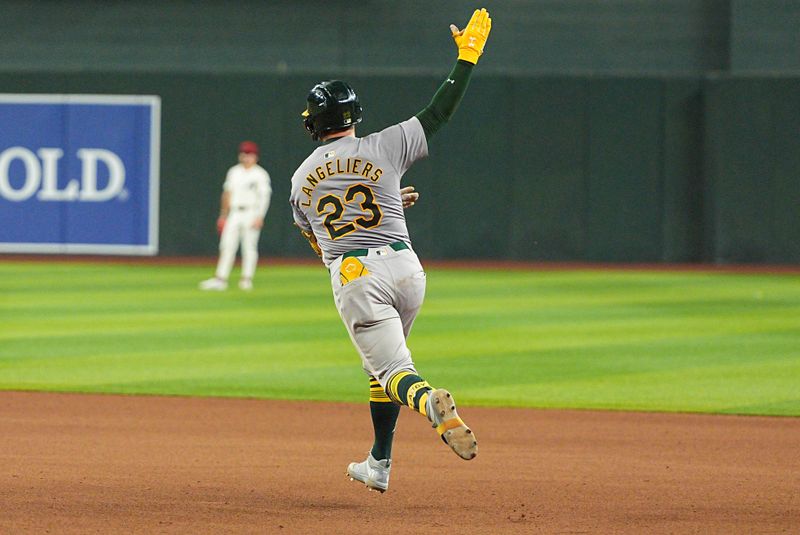 Jun 28, 2024; Phoenix, Arizona, USA; Oakland Athletics catcher Shea Langeliers (23) celebrates after hitting a home run in the eighth inning against Arizona Diamondbacks at Chase Field. Mandatory Credit: Allan Henry-USA TODAY Sports