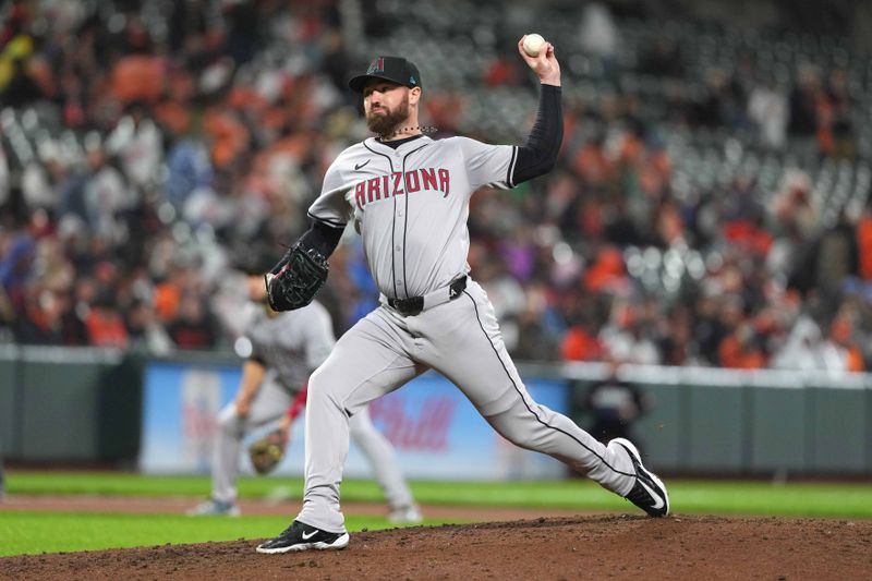 May 10, 2024; Baltimore, Maryland, USA; Arizona Diamondbacks pitcher Logan Allen (22) delivers in the seventh inning against the Baltimore Orioles at Oriole Park at Camden Yards. Mandatory Credit: Mitch Stringer-USA TODAY Sports