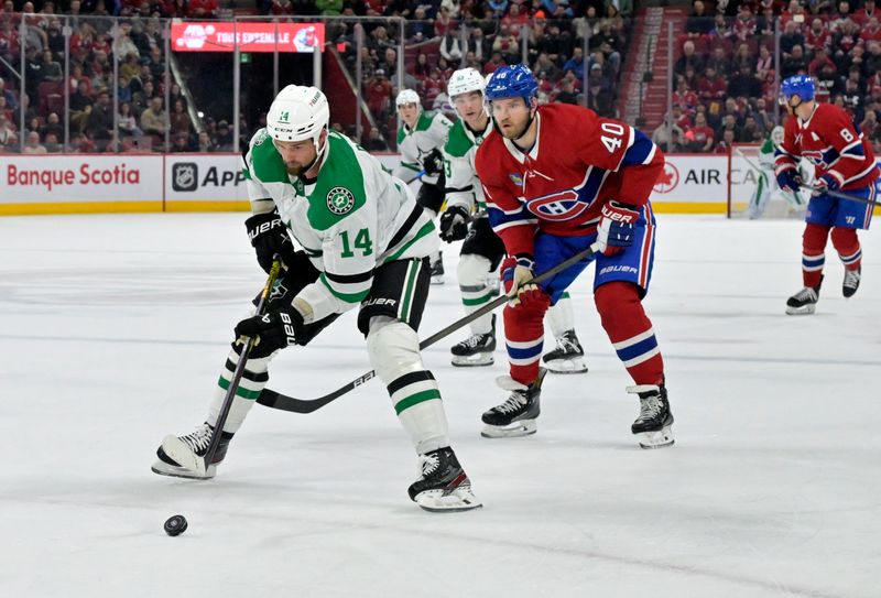 Feb 10, 2024; Montreal, Quebec, CAN; Dallas Stars forward Jamie Benn (14) controls the puck against Montreal Canadiens forward Joel Armia (40) during the first period at the Bell Centre. Mandatory Credit: Eric Bolte-USA TODAY Sports