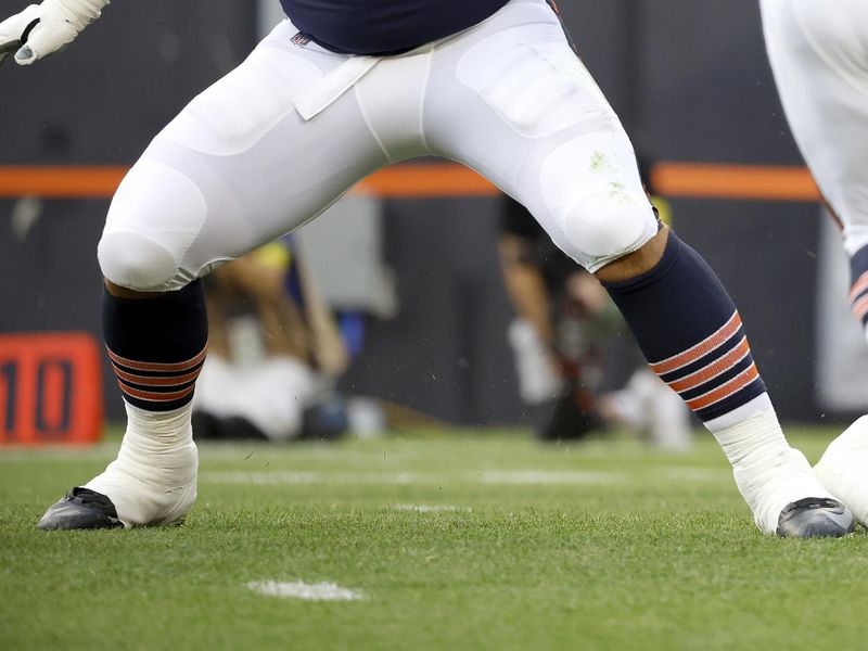 Chicago Bears center Cody Whitehair (65) looks to make a block during an NFL preseason football game against the Cleveland Browns, Saturday Aug. 27, 2022, in Cleveland. (AP Photo/Kirk Irwin)