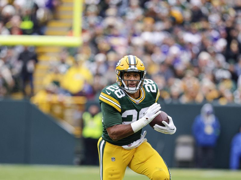 Green Bay Packers running back AJ Dillon (28) runs during an NFL football game against the Minnesota Vikings Sunday, Oct. 29, 2023, in Green Bay, Wis. (AP Photo/Jeffrey Phelps)