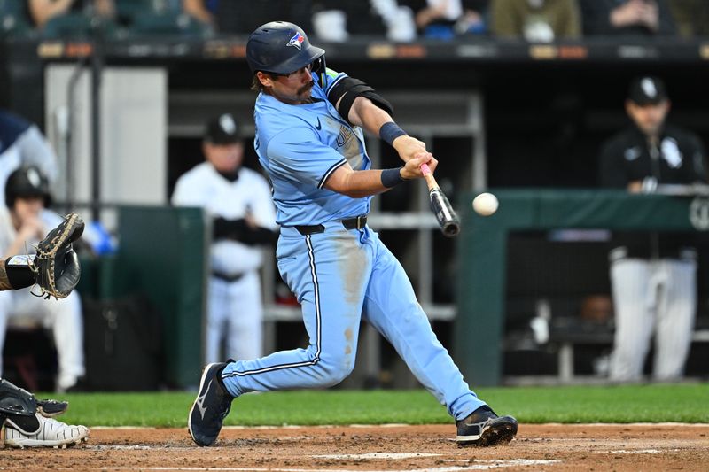 May 28, 2024; Chicago, Illinois, USA;  Toronto Blue Jays infielder Davis Schneider (36) hits a two-run double in the second inning against the Chicago White Sox at Guaranteed Rate Field. Mandatory Credit: Jamie Sabau-USA TODAY Sports