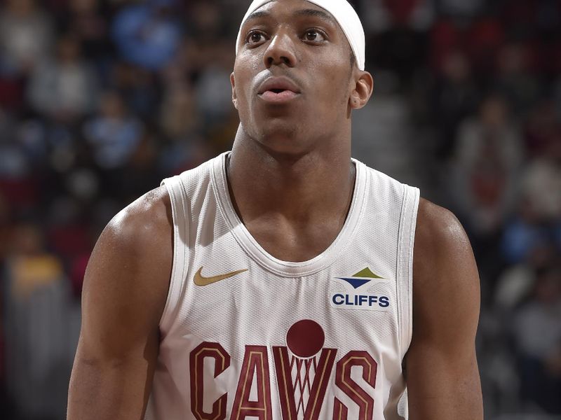CLEVELAND, OH - APRIL 13:  Nae'Qwan Tomlin #30 of the Cleveland Cavaliers shoots a free throw during the game against the Indiana Pacers on April 13, 2025 at Rocket Arena in Cleveland, Ohio. NOTE TO USER: User expressly acknowledges and agrees that, by downloading and/or using this Photograph, user is consenting to the terms and conditions of the Getty Images License Agreement. Mandatory Copyright Notice: Copyright 2025 NBAE (Photo by David Liam Kyle/NBAE via Getty Images)