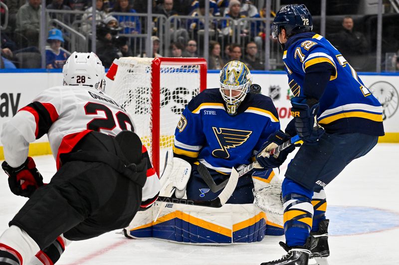 Dec 14, 2023; St. Louis, Missouri, USA;  St. Louis Blues goaltender Jordan Binnington (50) defends the net against Ottawa Senators right wing Claude Giroux (28) during the first period at Enterprise Center. Mandatory Credit: Jeff Curry-USA TODAY Sports