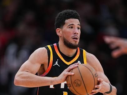 HOUSTON, TEXAS - DECEMBER 27: Devin Booker #1 of the Phoenix Suns holds the ball during the second quarter of the game against the Houston Rockets at Toyota Center on December 27, 2023 in Houston, Texas. User expressly acknowledges and agrees that, by downloading and or using this photograph, User is consenting to the terms and conditions of the Getty Images License Agreement. (Photo by Alex Bierens de Haan/Getty Images)