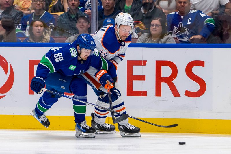 May 20, 2024; Vancouver, British Columbia, CAN; Vancouver Canucks forward Nils Aman (88) battles with Edmonton Oilers forward Zach Hyman (18) during the first period in game seven of the second round of the 2024 Stanley Cup Playoffs at Rogers Arena. Mandatory Credit: Bob Frid-USA TODAY Sports