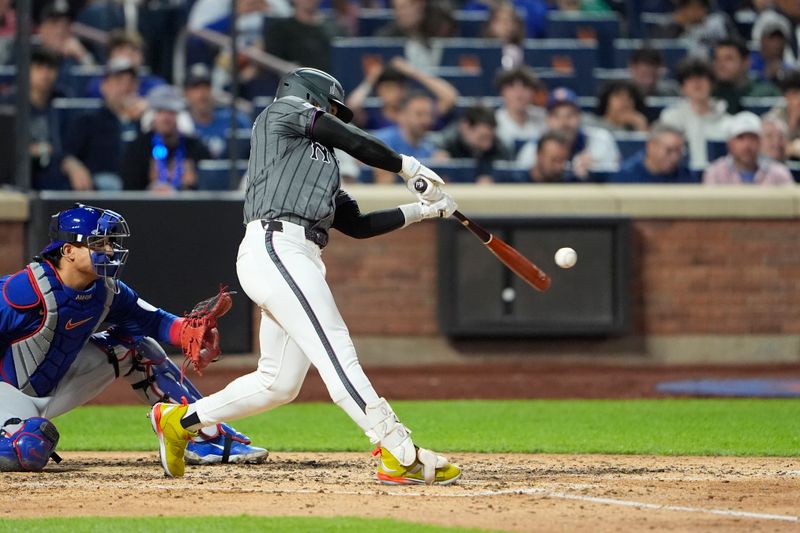 May 10, 2025; New York City, New York, USA; New York Mets shortstop Francisco Lindor (12) hits a single against the Chicago Cubs during the fifth inning at Citi Field. Mandatory Credit: Gregory Fisher-Imagn Images
