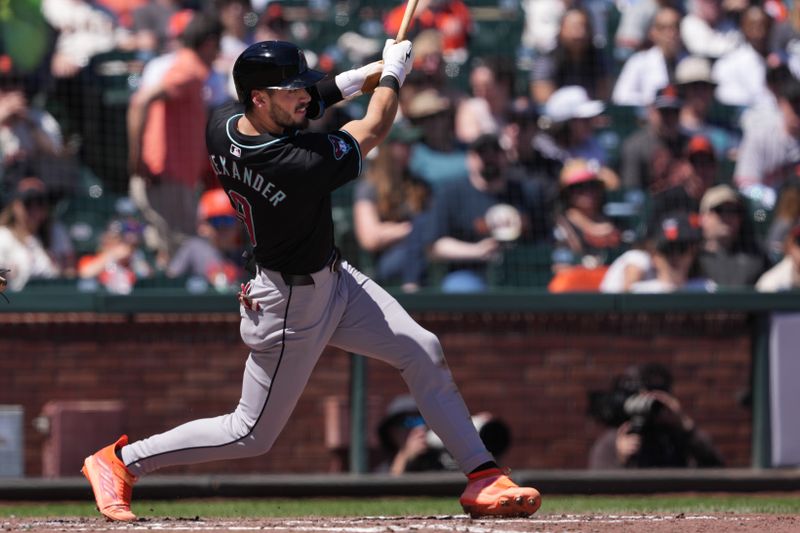 Apr 20, 2024; San Francisco, California, USA; Arizona Diamondbacks shortstop Blaze Alexander (9) hits an RBI double against the San Francisco Giants during the fourth inning at Oracle Park. Mandatory Credit: Darren Yamashita-USA TODAY Sports