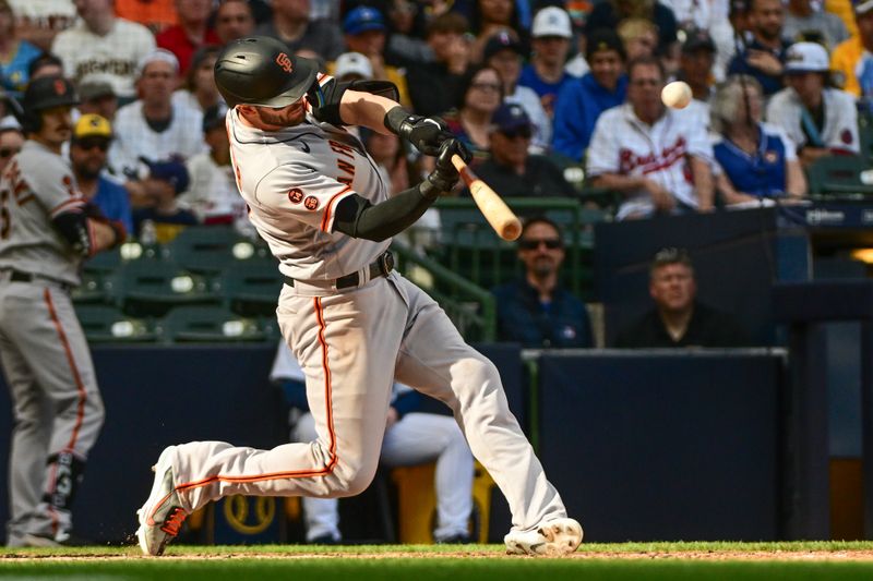 May 27, 2023; Milwaukee, Wisconsin, USA; San Francisco Giants left fielder Mitch Haniger (17) hits a two run home run in the eighth inning against the Milwaukee Brewers at American Family Field. Mandatory Credit: Benny Sieu-USA TODAY Sports