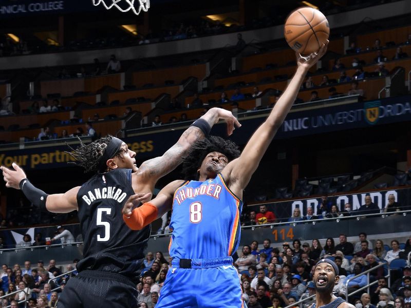 ORLANDO, FL - JANUARY 4:  Jalen Williams #8 of the Oklahoma City Thunder goes to the basket against the Orlando Magic on January 4, 2023 at Amway Center in Orlando, Florida. NOTE TO USER: User expressly acknowledges and agrees that, by downloading and or using this photograph, User is consenting to the terms and conditions of the Getty Images License Agreement. Mandatory Copyright Notice: Copyright 2023 NBAE (Photo by Gary Bassing/NBAE via Getty Images)