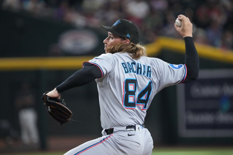 Jun 29, 2025; Phoenix, Arizona, USA; Miami Marlins pitcher Lake Bachar (84) pitches against the Arizona Diamondbacks during the sixth inning at Chase Field. Mandatory Credit: Joe Camporeale-Imagn Images