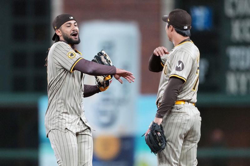 Apr 6, 2024; San Francisco, California, USA; San Diego Padres right fielder Fernando Tatis Jr. (left) celebrates with shortstop Ha-Seong Kim (right) after defeating the San Francisco Giants at Oracle Park. Mandatory Credit: Darren Yamashita-USA TODAY Sports