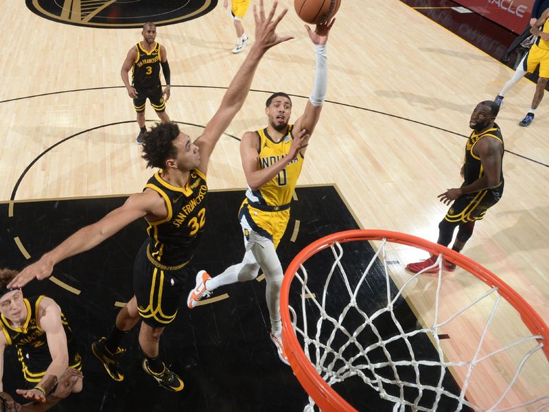 SAN FRANCISCO, CA - MARCH 22: Tyrese Haliburton #0 of the Indiana Pacers drives to the basket during the game against the Golden State Warriors on March 22, 2024 at Chase Center in San Francisco, California. NOTE TO USER: User expressly acknowledges and agrees that, by downloading and or using this photograph, user is consenting to the terms and conditions of Getty Images License Agreement. Mandatory Copyright Notice: Copyright 2024 NBAE (Photo by Noah Graham/NBAE via Getty Images)