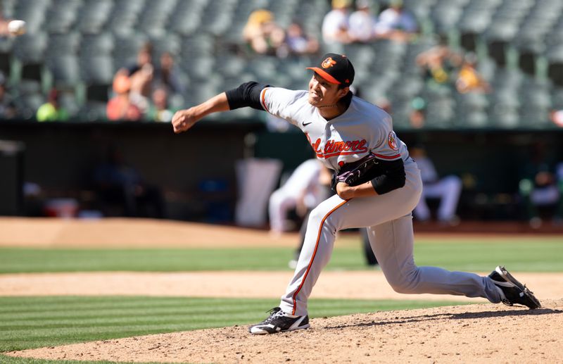 Aug 20, 2023; Oakland, California, USA; Baltimore Orioles pitcher Shintaro Fujinami (14) delivers a pitch against the Oakland Athletics during the ninth inning at Oakland-Alameda County Coliseum. Mandatory Credit: D. Ross Cameron-USA TODAY Sports