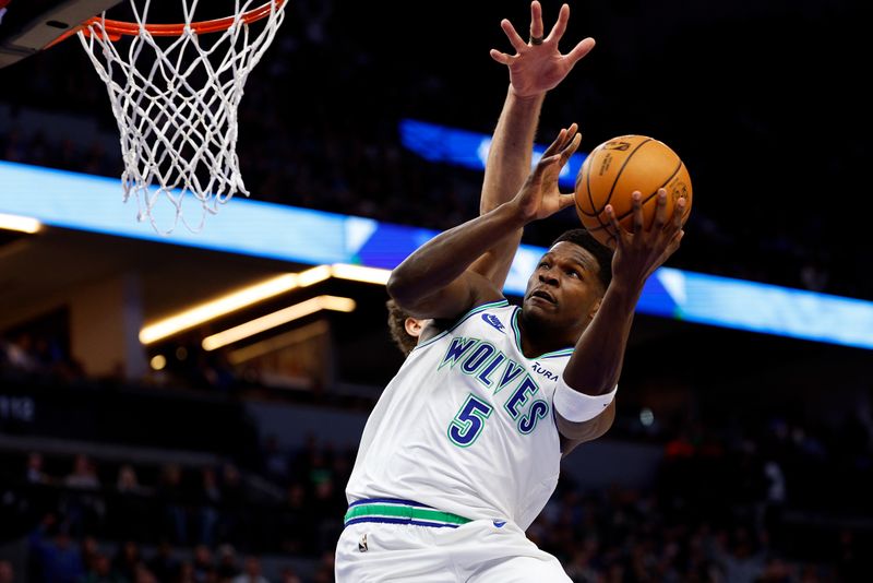 MINNEAPOLIS, MINNESOTA - FEBRUARY 23: Anthony Edwards #5 of the Minnesota Timberwolves goes up for a shot against the Milwaukee Bucks in the first quarter at Target Center on February 23, 2024 in Minneapolis, Minnesota. NOTE TO USER: User expressly acknowledges and agrees that, by downloading and or using this photograph, User is consenting to the terms and conditions of the Getty Images License Agreement. (Photo by David Berding/Getty Images)