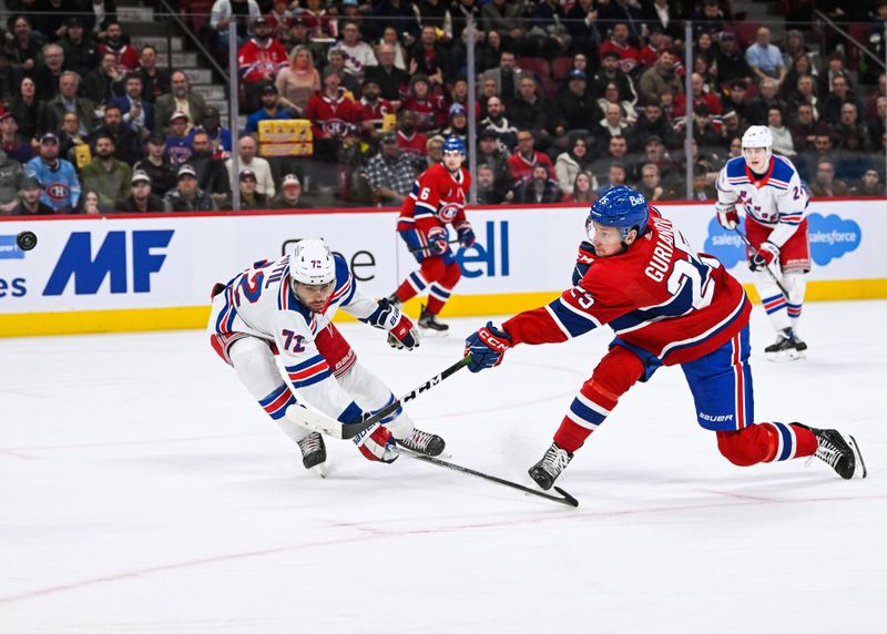 Mar 9, 2023; Montreal, Quebec, CAN; Montreal Canadiens right wing Denis Gurianov (25) shoots the puck against New York Rangers center Filip Chytil (72) during the second period at Bell Centre. Mandatory Credit: David Kirouac-USA TODAY Sports