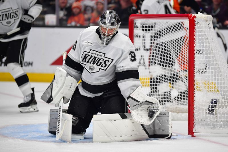 Nov 28, 2025; Anaheim, California, USA; Los Angeles Kings goaltender Darcy Kuemper (35) blocks a shot against the Anaheim Ducks during the second period at Honda Center. Mandatory Credit: Gary A. Vasquez-Imagn Images