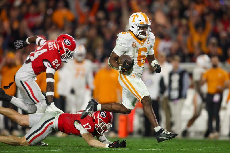 Nov 16, 2024; Athens, Georgia, USA; Tennessee Volunteers running back Dylan Sampson (6) runs the ball for a touchdown against the Georgia Bulldogs in the second quarter at Sanford Stadium. Mandatory Credit: Brett Davis-Imagn Images