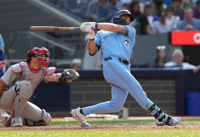 Sep 4, 2024; Toronto, Ontario, CAN; Toronto Blue Jays first baseman Spencer Horwitz (48) hits a single against the Philadelphia Phillies during the seventh inning at Rogers Centre. Mandatory Credit: Nick Turchiaro-Imagn Images