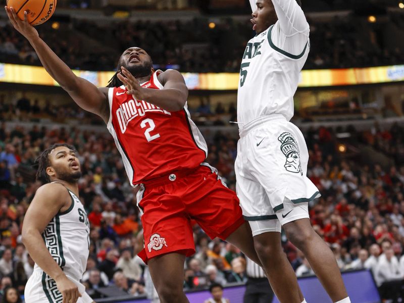 Mar 10, 2023; Chicago, IL, USA; Ohio State Buckeyes guard Bruce Thornton (2) goes to the basket against Michigan State Spartans guard Tre Holloman (5) during the first half at United Center. Mandatory Credit: Kamil Krzaczynski-USA TODAY Sports