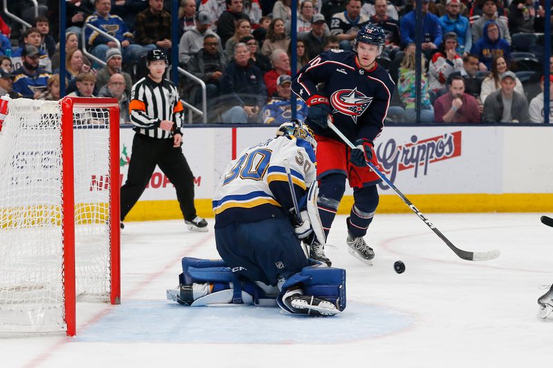 Dec 8, 2023; Columbus, Ohio, USA; St. Louis Blues goalie Joel Hofer (30) makes a save from the shot of Columbus Blue Jackets left wing Dmitri Voronkov (10)  during the second period at Nationwide Arena. Mandatory Credit: Russell LaBounty-USA TODAY Sports