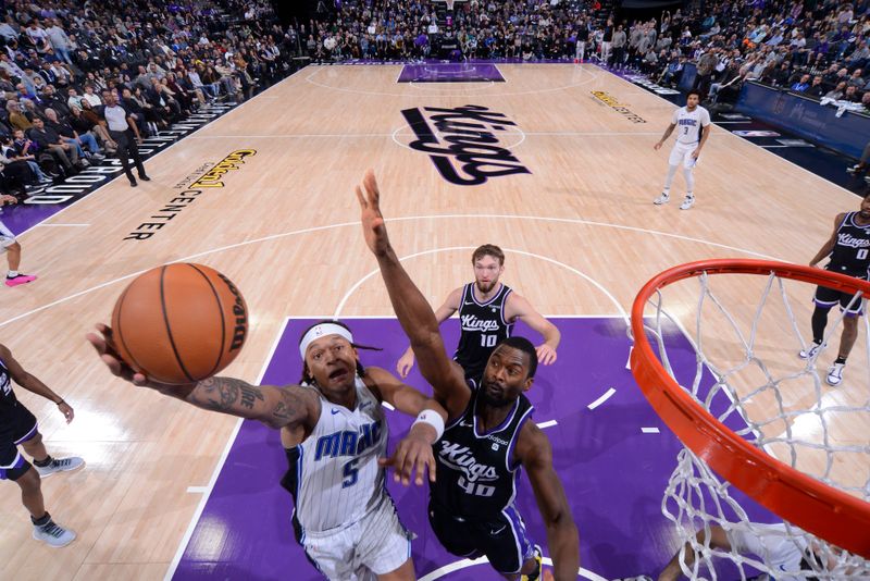 SACRAMENTO, CA - JANUARY 3: Paolo Banchero #5 of the Orlando Magic drives to the basket during the game against the Sacramento Kings on January 3, 2024 at Golden 1 Center in Sacramento, California. NOTE TO USER: User expressly acknowledges and agrees that, by downloading and or using this Photograph, user is consenting to the terms and conditions of the Getty Images License Agreement. Mandatory Copyright Notice: Copyright 2024 NBAE (Photo by Rocky Widner/NBAE via Getty Images)