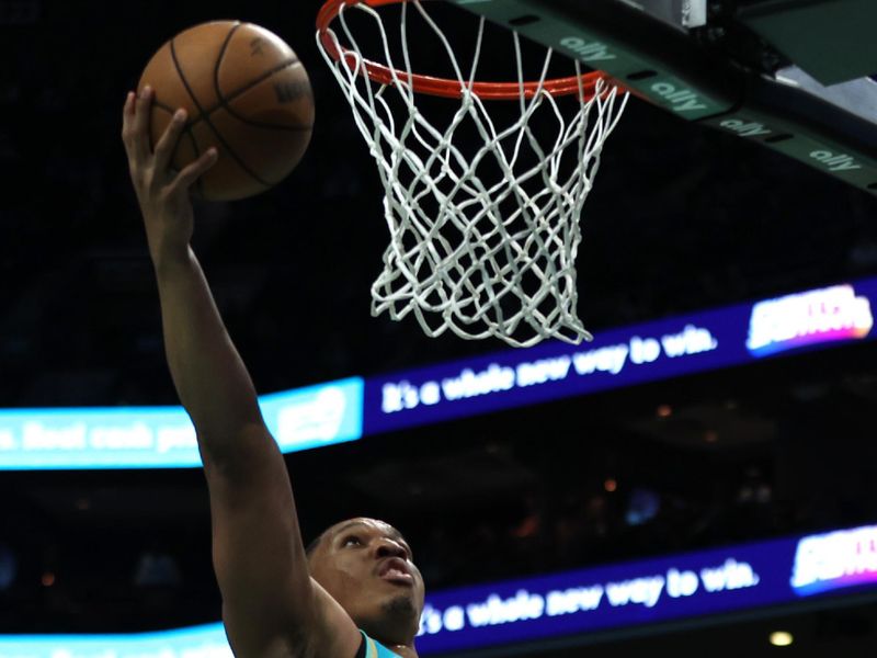 CHARLOTTE, NORTH CAROLINA - APRIL 09: Grant Williams #2 of the Charlotte Hornets lays the ball up during the first half of an NBA game against the Dallas Mavericks at Spectrum Center on April 09, 2024 in Charlotte, North Carolina. NOTE TO USER: User expressly acknowledges and agrees that, by downloading and or using this photograph, User is consenting to the terms and conditions of the Getty Images License Agreement. (Photo by David Jensen/Getty Images)