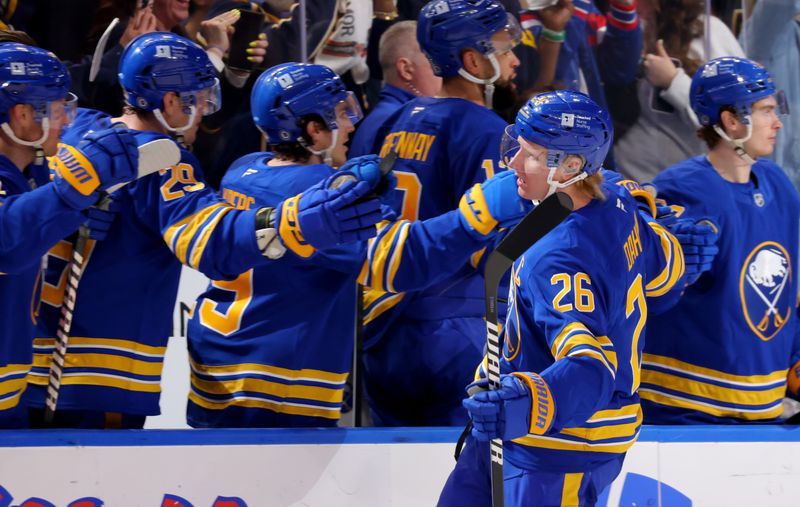 Mar 15, 2025; Buffalo, New York, USA;  Buffalo Sabres defenseman Rasmus Dahlin (26) celebrates his goal with teammates during the third period against the Vegas Golden Knights at KeyBank Center. Mandatory Credit: Timothy T. Ludwig-Imagn Images