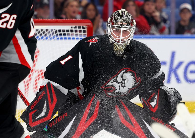Nov 6, 2025; Buffalo, New York, USA;  Buffalo Sabres goaltender Ukko-Pekka Luukkonen (1) looks for the puck during the third period against the St. Louis Blues at KeyBank Center. Mandatory Credit: Timothy T. Ludwig-Imagn Images