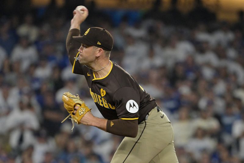 Oct 11, 2024; Los Angeles, California, USA; San Diego Padres pitcher Jason Adam (40) pitches in the eighth inning against the Los Angeles Dodgers during game five of the NLDS for the 2024 MLB Playoffs at Dodger Stadium. Mandatory Credit: Jayne Kamin-Oncea-Imagn Images