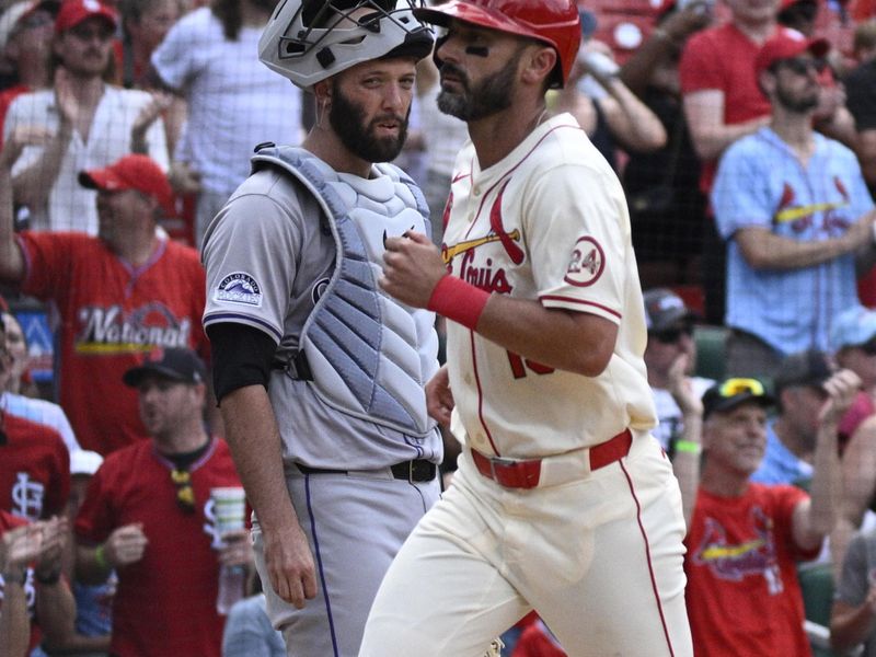 Jun 8, 2024; St. Louis, Missouri, USA; Colorado Rockies catcher Jacob Stallings (25) watches as St. Louis Cardinals designated hitter Matt Carpenter (13) crosses home plate after hitting a home run during the seventh inning at Busch Stadium. Mandatory Credit: Jeff Le-USA TODAY Sports