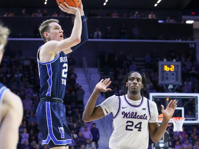 Feb 24, 2024; Manhattan, Kansas, USA; Brigham Young Cougars guard Spencer Johnson (20) shoots against Kansas State Wildcats forward Arthur Maluma (24) late in the second half at Bramlage Coliseum. Mandatory Credit: Scott Sewell-USA TODAY Sports