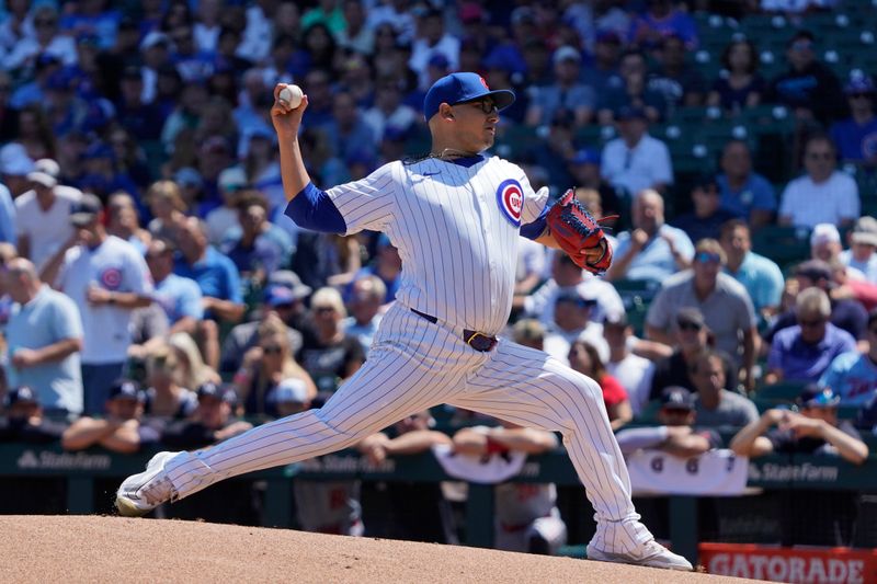 Aug 7, 2024; Chicago, Illinois, USA; Chicago Cubs pitcher Javier Assad (72) throws against the Minnesota Twins during the first inning at Wrigley Field. Mandatory Credit: David Banks-USA TODAY Sports