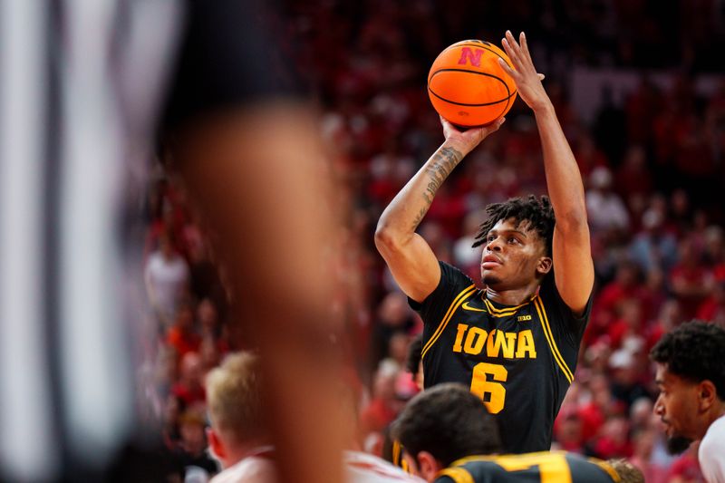 Mar 8, 2026; Lincoln, Nebraska, USA; Iowa Hawkeyes guard Tavion Banks (6) shoots a free throw against the Nebraska Cornhuskers during overtime at Pinnacle Bank Arena. Mandatory Credit: Dylan Widger-Imagn Images Mar 8, 2026; Lincoln, Nebraska, USA; Iowa Hawkeyes guard Tavion Banks (6) shoots a free throw against the Nebraska Cornhuskers during overtime at Pinnacle Bank Arena. Mandatory Credit: Dylan Widger-Imagn Images