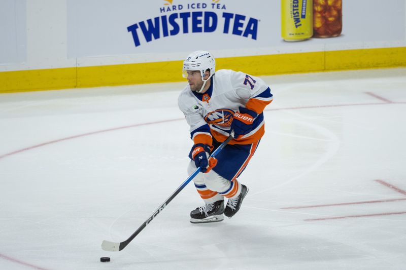 Oct 18, 2025; Ottawa, Ontario, CAN; New York Islanders defenseman Tony DeAngelo (77) skates with the puck in the third period against the Ottawa Senators at the Canadian Tire Centre. Mandatory Credit: Marc DesRosiers-IMAGN Images