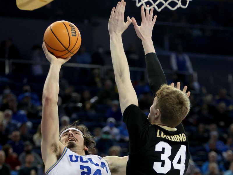 Jan 14, 2023; Los Angeles, California, USA; UCLA Bruins guard Jaime Jaquez Jr. (24) shoots the ball against Colorado Buffaloes center Lawson Lovering (34) during the second half at Pauley Pavilion presented by Wescom. Mandatory Credit: Kiyoshi Mio-USA TODAY Sports