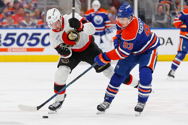 Mar 3, 2026; Edmonton, Alberta, CAN; Edmonton Oilers forward Ryan Nugent-Hopkins (93) and Ottawa Senators forward Drake Batherson (19) battle for a loose puck during the third period at Rogers Place. Mandatory Credit: Perry Nelson-Imagn Images