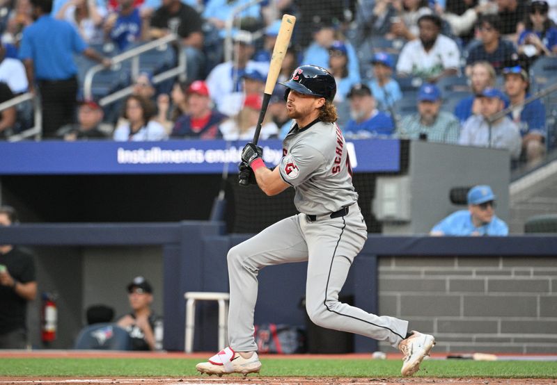 Jun 14, 2024; Toronto, Ontario, CAN;  Cleveland Indians center fielder Daniel Schneemann (10) hits an RBI double against the Toronto Blue Jays in the second inning at Rogers Centre. Mandatory Credit: Dan Hamilton-USA TODAY Sports