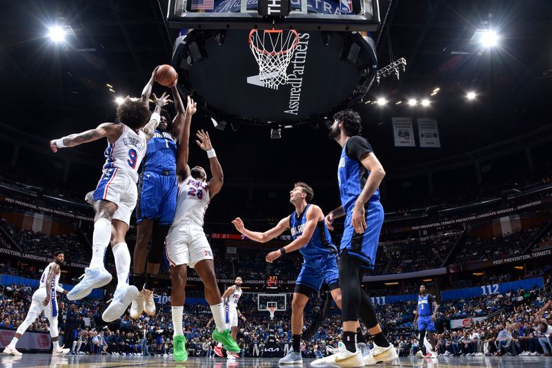 ORLANDO, FL - NOVEMBER 15: Jonathan Isaac #1 of the Orlando Magic goes up for the rebound during the game against the Philadelphia 76ers during the Emirates NBA Cup game on  November 15, 2024 at Kia Center in Orlando, Florida. NOTE TO USER: User expressly acknowledges and agrees that, by downloading and or using this photograph, User is consenting to the terms and conditions of the Getty Images License Agreement. Mandatory Copyright Notice: Copyright 2024 NBAE (Photo by Fernando Medina/NBAE via Getty Images)