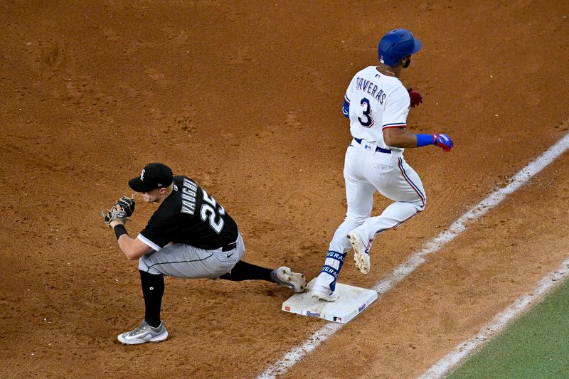 Aug 3, 2023; Arlington, Texas, USA; Chicago White Sox first baseman Andrew Vaughn (25) puts out Texas Rangers center fielder Leody Taveras (3) at first base during the sixth inning at Globe Life Field. Mandatory Credit: Jerome Miron-USA TODAY Sports