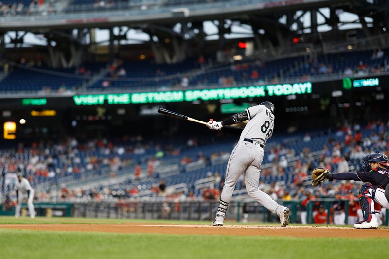 Sep 19, 2023; Washington, District of Columbia, USA; Chicago White Sox center fielder Luis Robert Jr. (88) singles against the Washington Nationals during the first inning at Nationals Park. Mandatory Credit: Geoff Burke-USA TODAY Sports